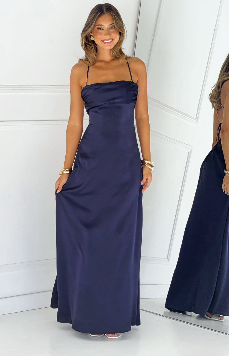Full length navy satin maxi dress with a soft draped straight neckline and thin straps