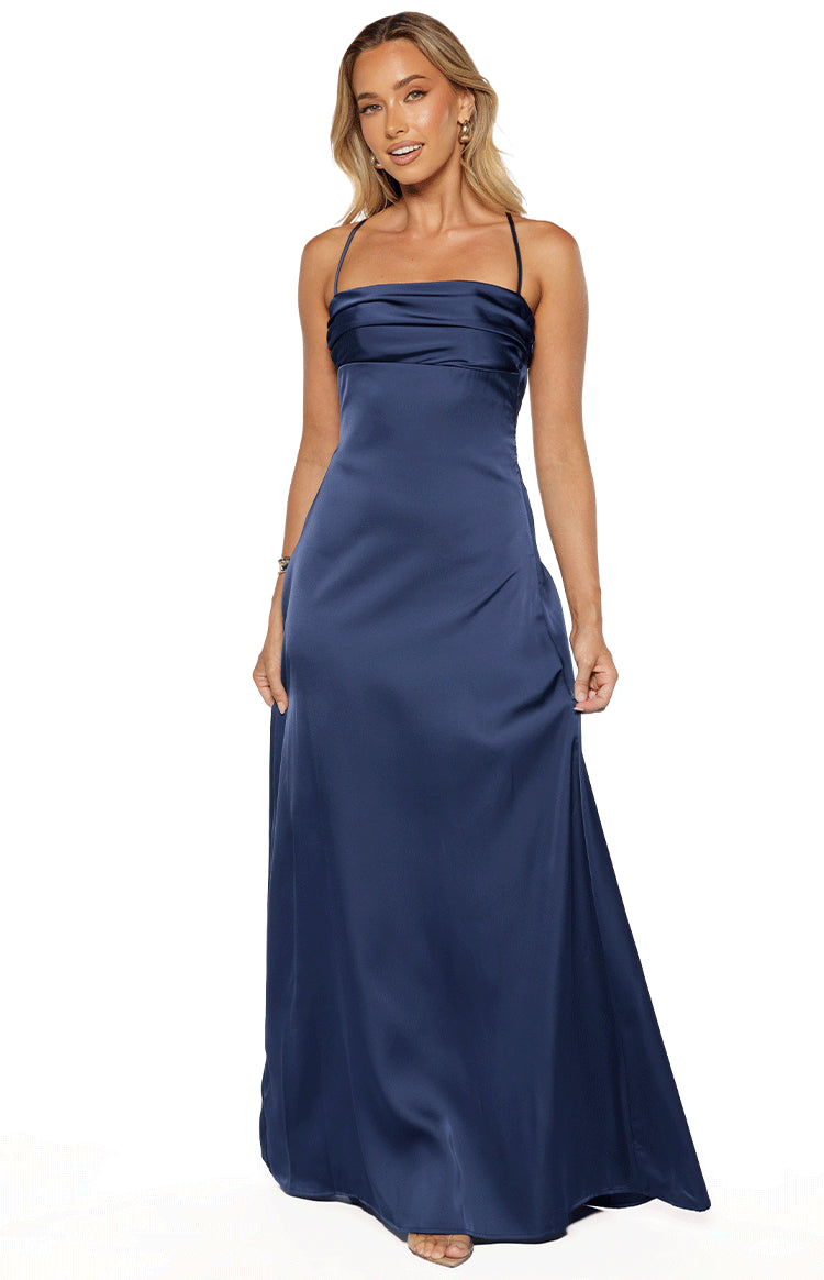 Full length front view of a navy satin maxi dress with a draped straight neckline and thin spaghetti straps