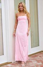 Pink satin maxi dress with a ruched straight neckline, thin spaghetti straps, and a flowing skirt
