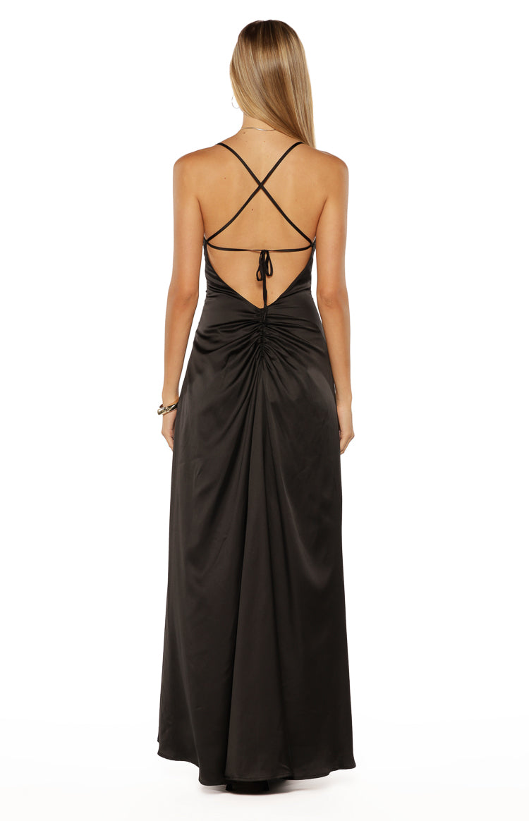 Rear view of a black satin maxi dress with criss-cross spaghetti straps, low scoop back, and ruched detail