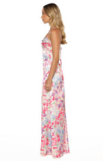 Side view of a multi floral satin maxi dress with a cowl neck, spaghetti straps, and a delicate tie-back