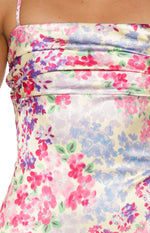 Close-up of the ruched bodice and multi floral pattern on the satin maxi dress