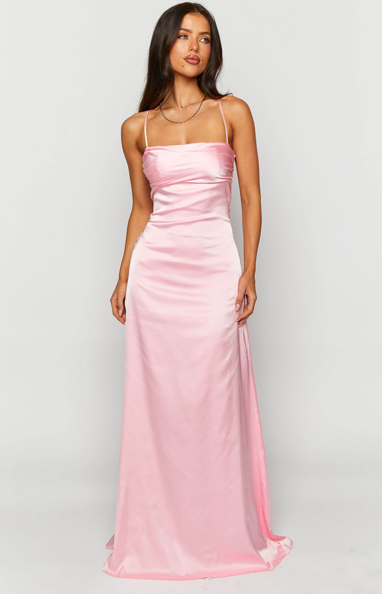 Pink satin maxi dress with thin spaghetti straps, a straight neckline, and ruched bust detail
