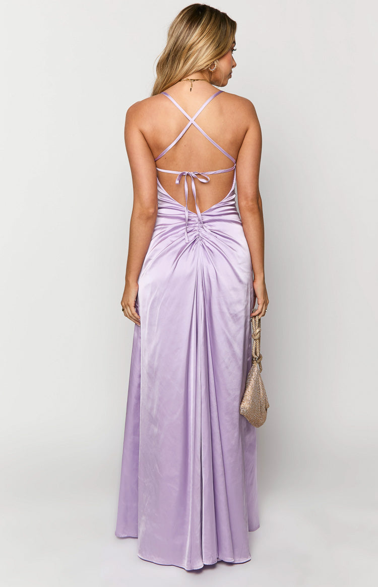 Rear view of a lilac satin maxi dress with criss-cross back straps, a tie-back closure, and ruched detail at the lower back