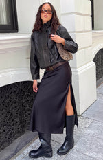 Brown PU jacket with a buttoned funnel neck, button-front closure, and flap chest pockets