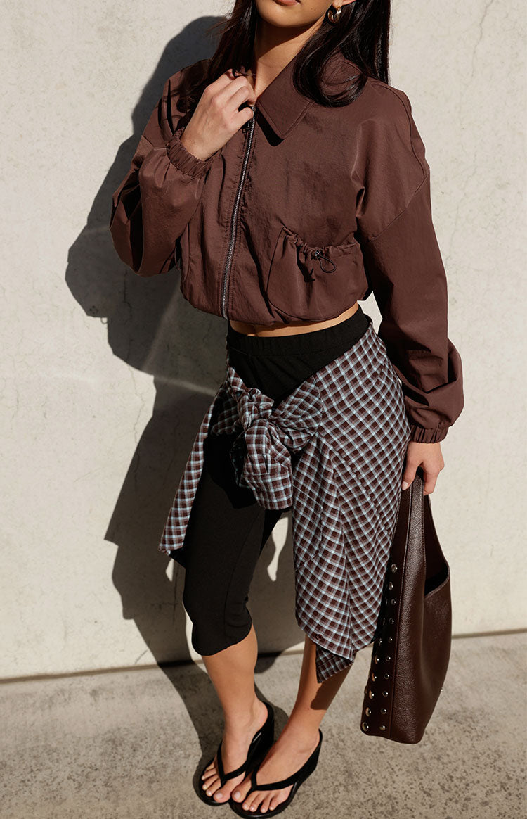 Chocolate cropped bomber jacket with a collar, full zip, and side drawstring hem detail