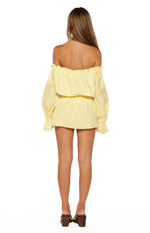 Rear view of the yellow bardot mini dress showing the ruffled off-shoulder neckline and elasticated blouson waist