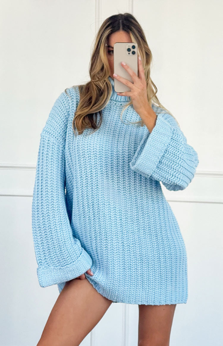 Light blue chunky knit sweater dress with a high turtleneck and oversized cuffed long sleeves