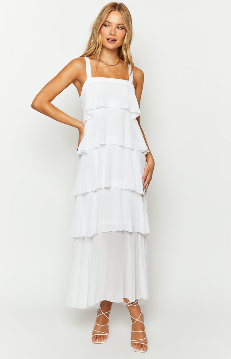 White square neck maxi dress with thick straps and multiple tiers of flowing frills down to the hem