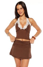 Fitted brown polka dot halter neck top with white lace trim on the deep V-neckline
