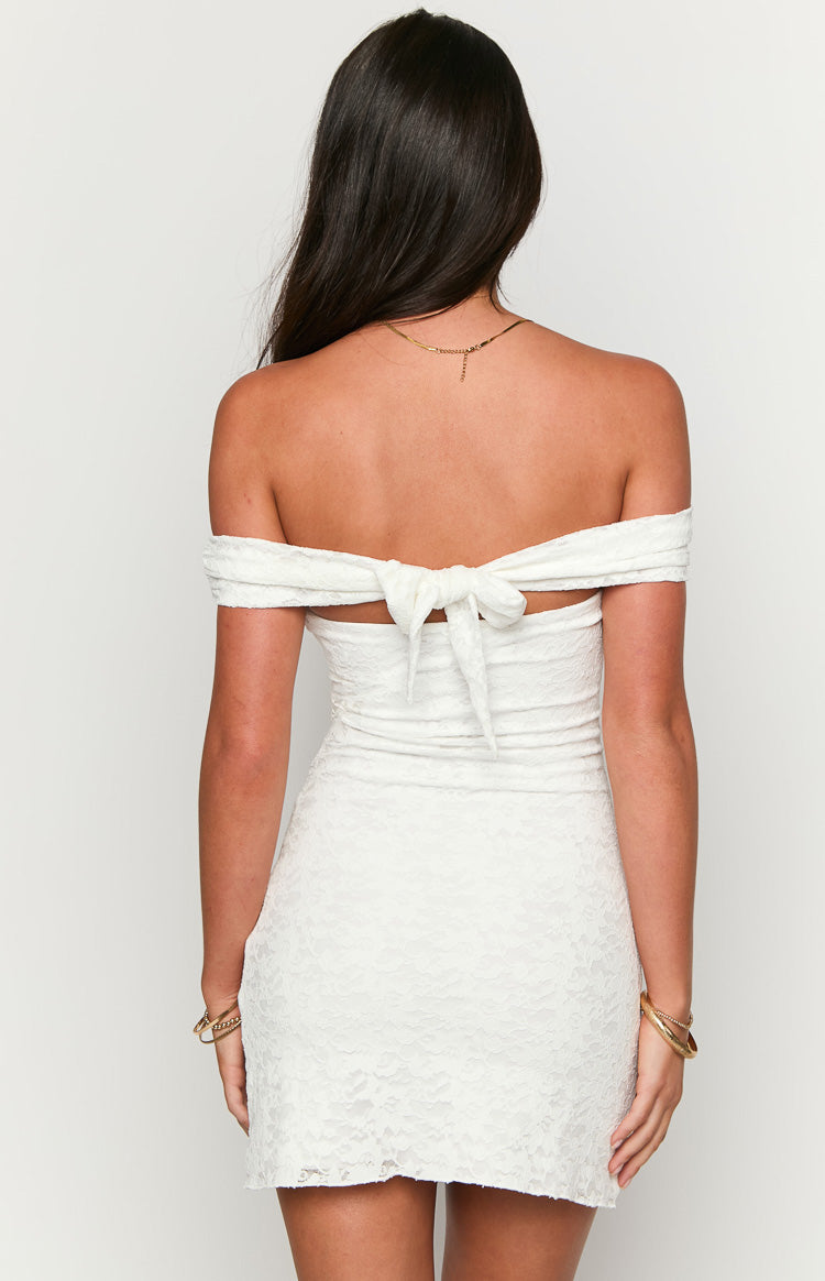 Rear view of a white lace off-the-shoulder mini dress with a tie-back detail at the upper back