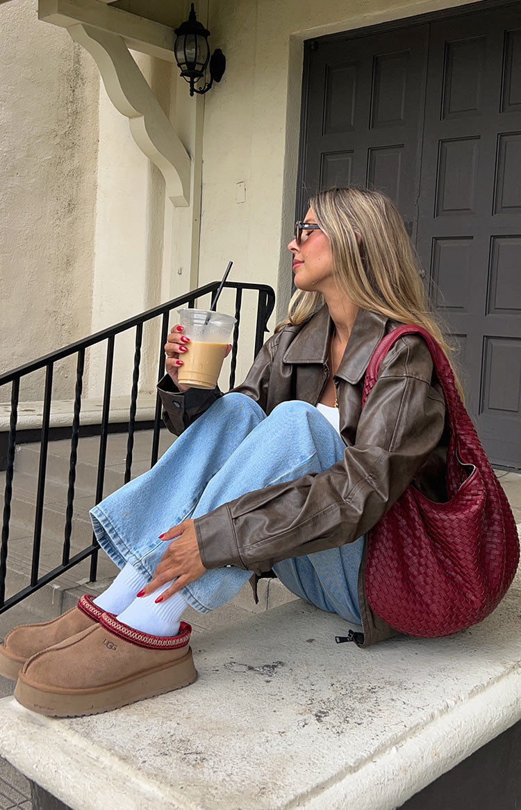 Light wash slouchy jeans with a wide leg and cuffed hem