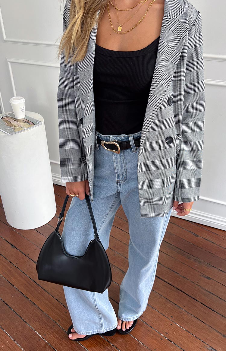 Light wash mid-rise slouchy jeans with a relaxed fit through the leg and a full-length hem