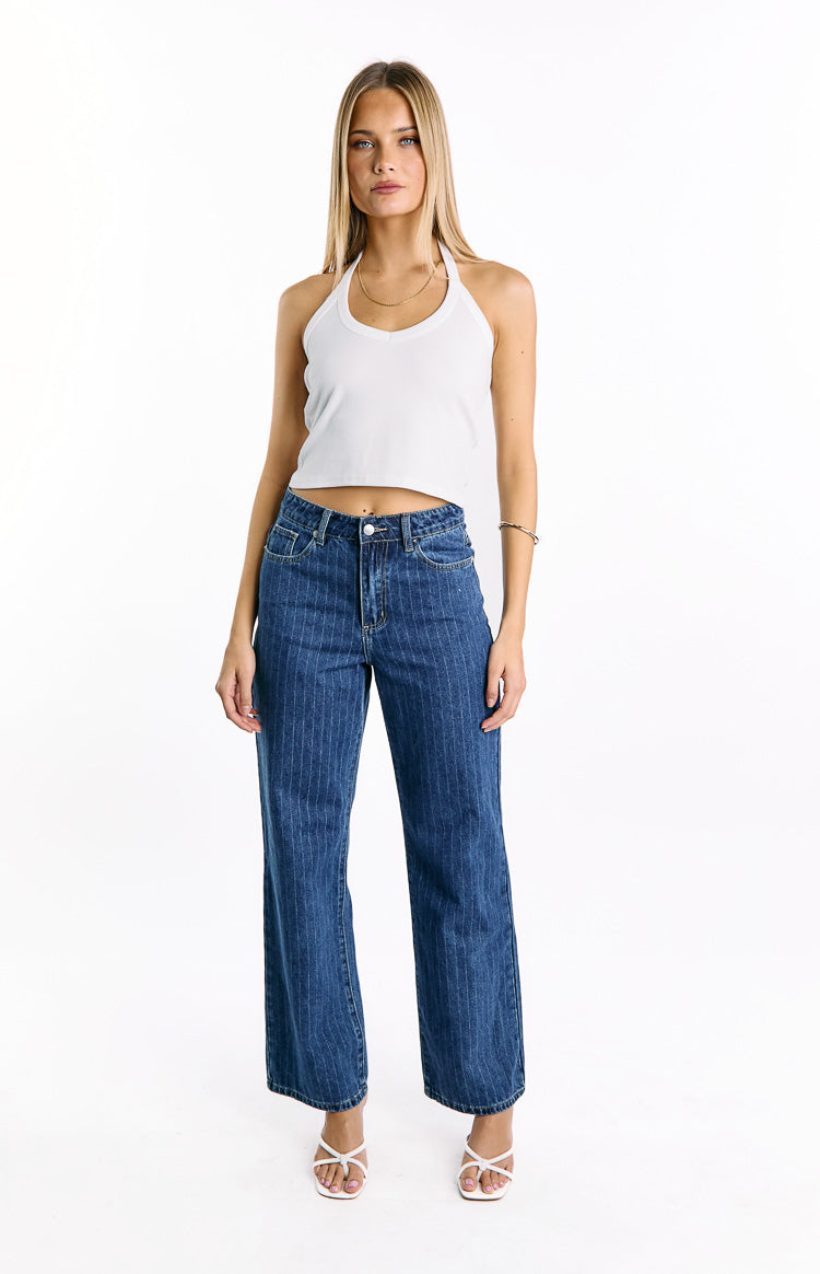 Front view of mid-wash blue pinstripe denim jeans with a mid-rise waist and slouchy wide-leg fit