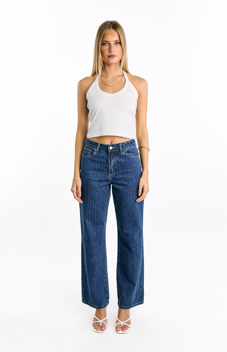 Front view of mid wash blue pinstripe slouchy jeans with a mid-rise and wide-leg fit