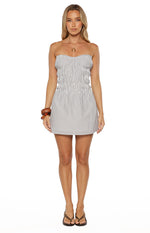 Front view of a blue stripe strapless mini dress with a shirred bodice and A-line skirt