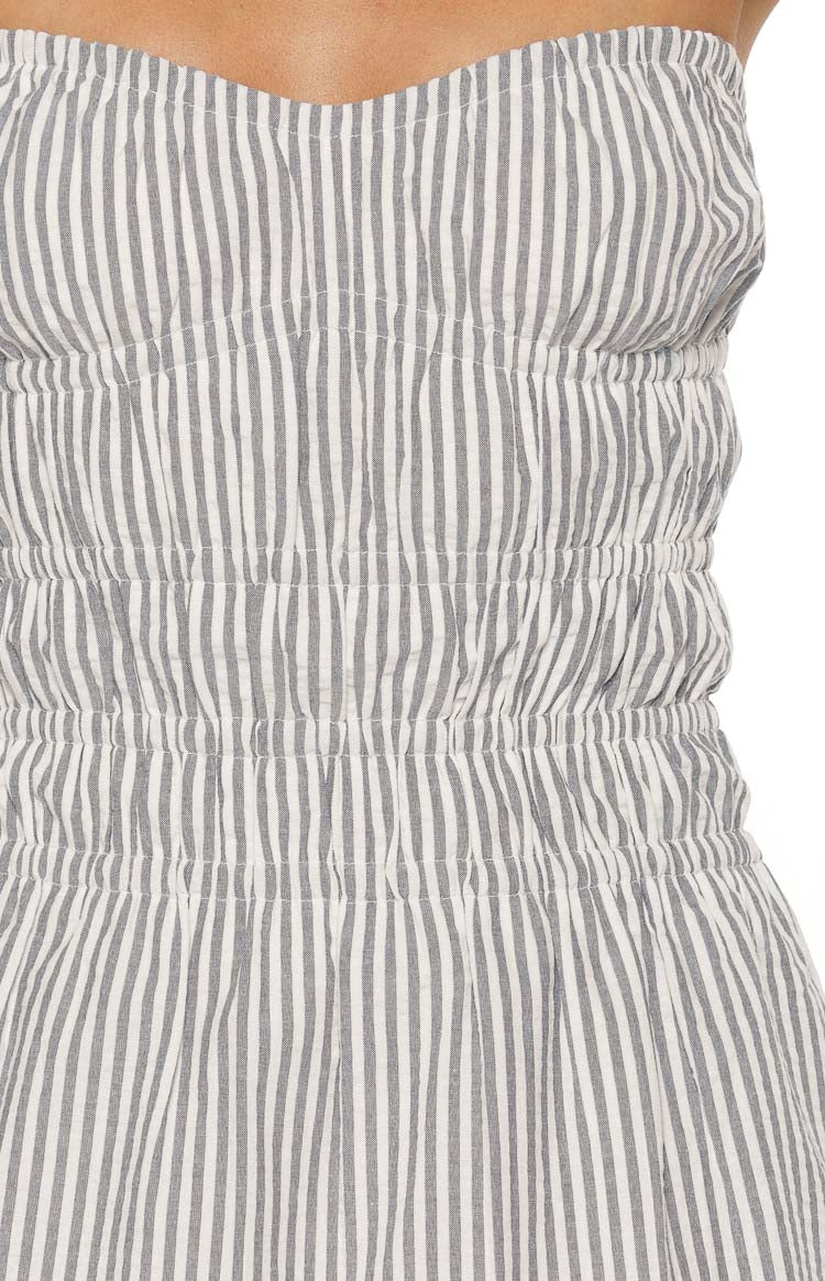 Detail of the shirred bodice and elasticated waist of the blue and white striped dress