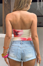 Rear view of a fitted yellow and pink floral print strapless tube top with a straight back neckline