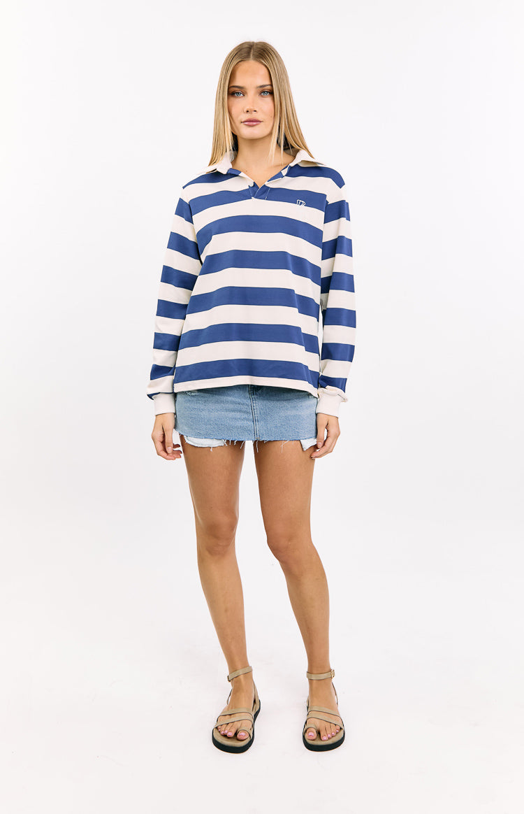 Blue and cream horizontal striped jersey with a white collared V-neck and long sleeves