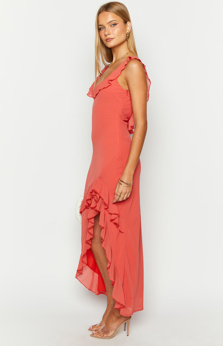 Side view of a red maxi dress with ruffled V-neck, ruffled straps, and a ruffled high-low hem with a thigh split