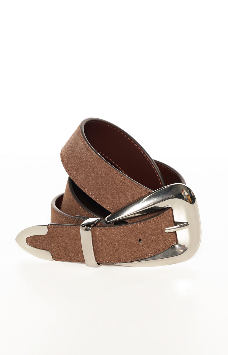 Close-up of the dark brown suedette belt coiled, highlighting the textured fabric and ornate silver western buckle with matching tip