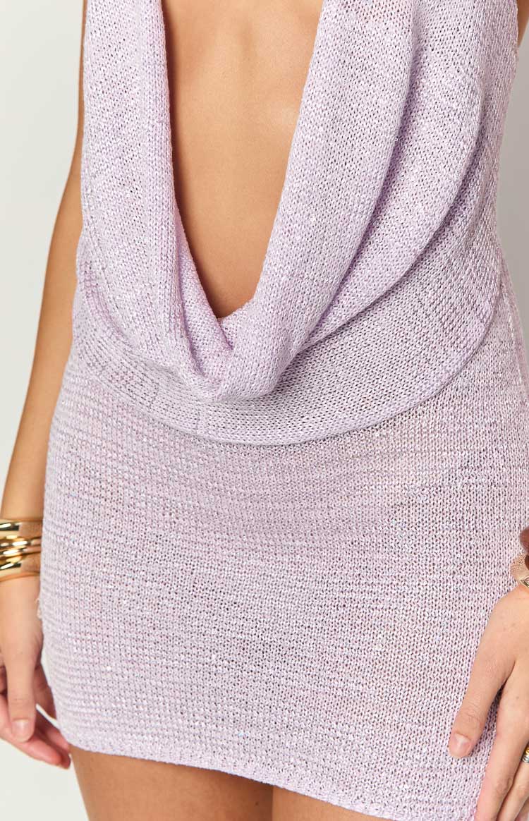 Detail shot of the lilac cowl neck and the shimmering knitted fabric of the dress