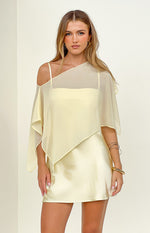 Yellow satin mini dress with a sheer asymmetric draped overlay and thin spaghetti straps