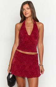 Red patterned velvet halter crop top with a deep V-neck and ruched detailing