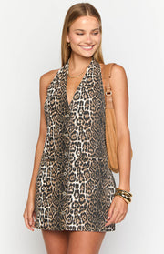 Leopard print halter neck mini dress with a deep V-neckline and button-front detail