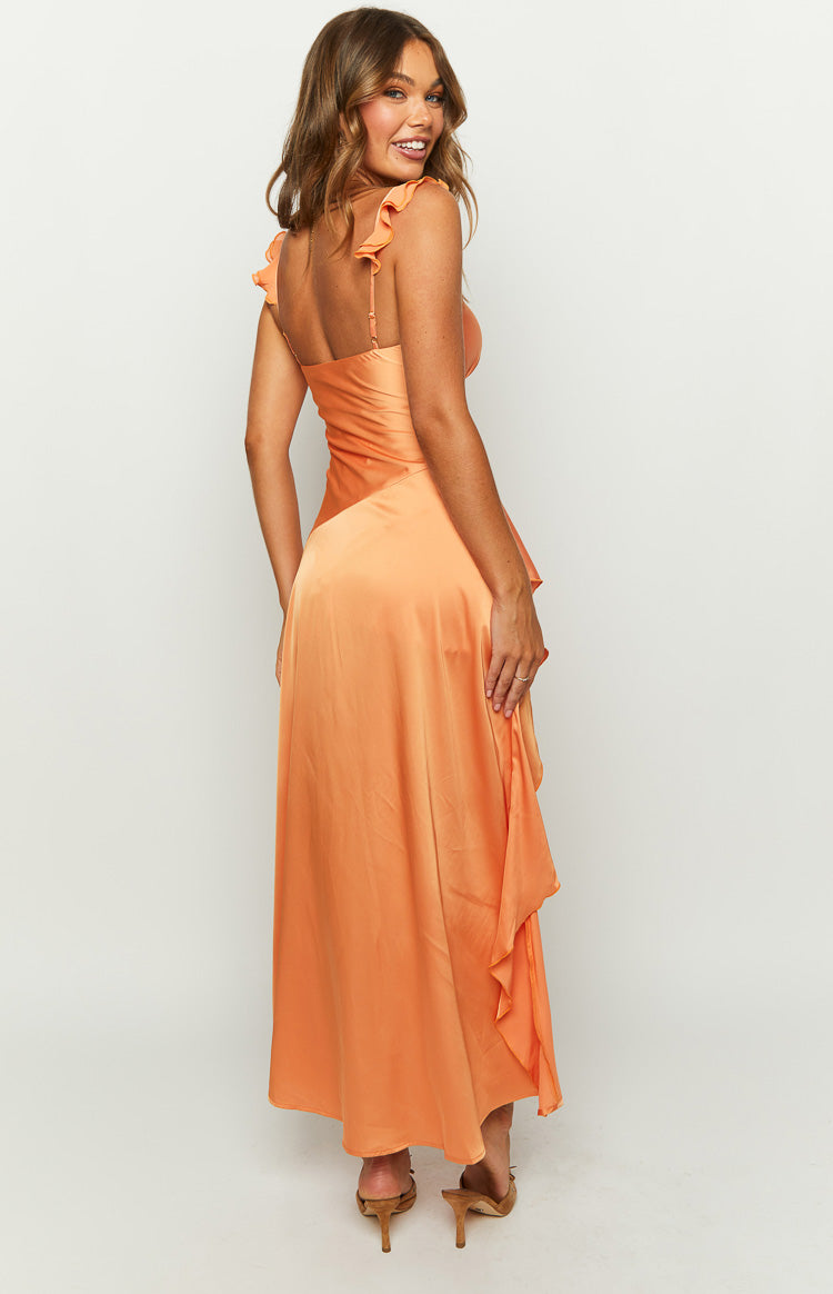 Rear-side view of an orange satin maxi dress with ruffled shoulder straps and a draped side skirt