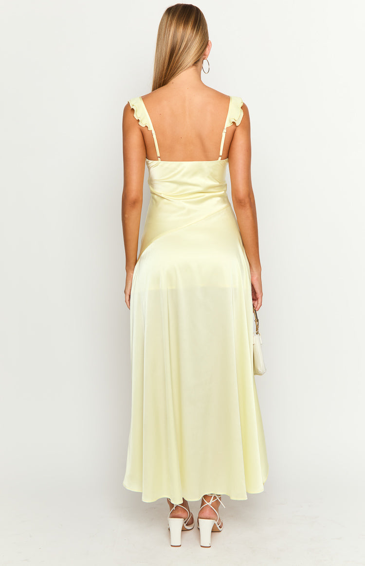 Rear view of a yellow satin maxi dress with ruffled spaghetti straps and a straight back