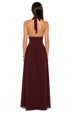 Rear view of the burgundy maxi dress with a halter neck tie, low open back, and high ruched waist