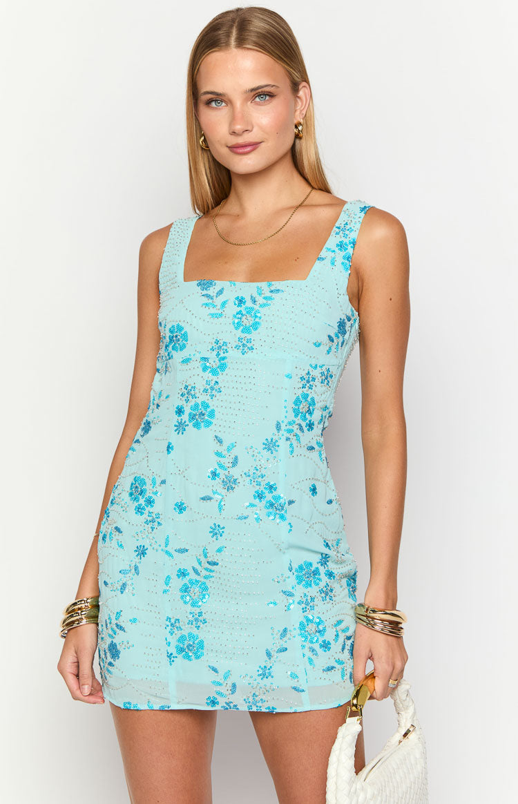 Close-up of the light blue mini dress with a square neckline and intricate blue floral beading and silver accents