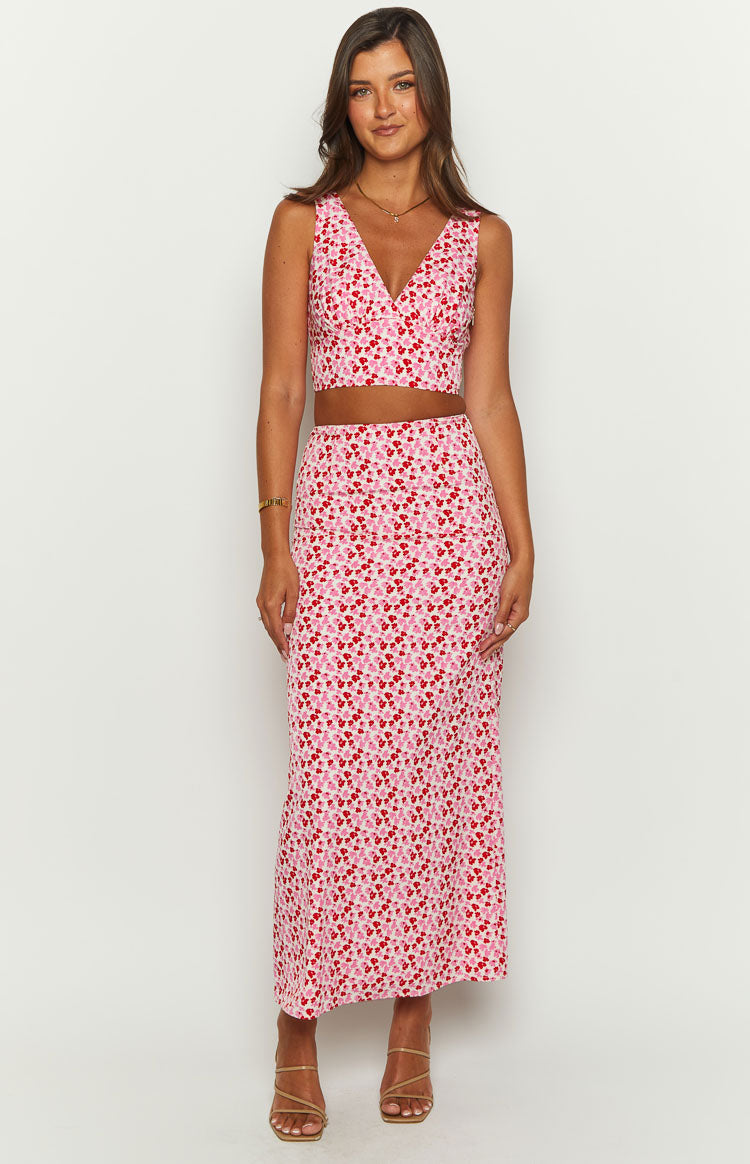 Front view of a pink and red speckled high-waisted maxi skirt with a straight, flowy silhouette