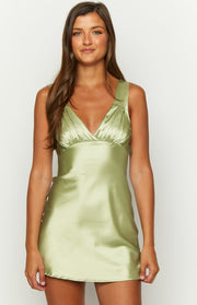 Close-up of the sage satin V-neck mini dress with gathered detail under the bust