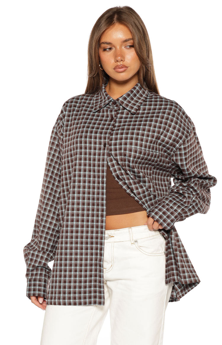 Open brown and light blue plaid long sleeve shirt with a pointed collar and relaxed fit