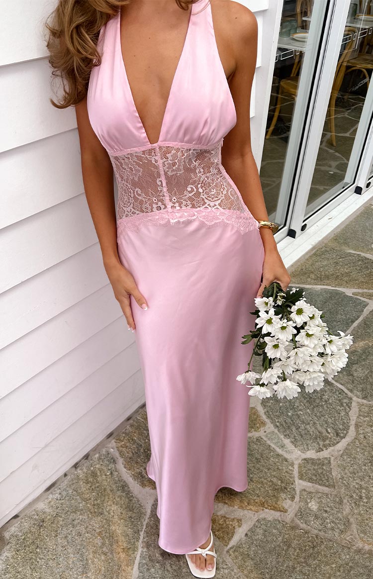 Pink satin halter neck maxi dress with a deep V-neck and sheer lace panel at the waist with lace trim