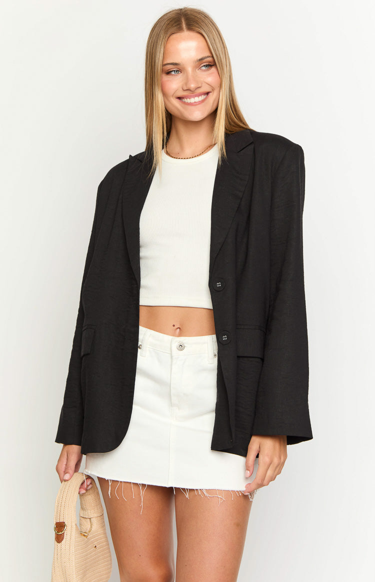 Open black linen blend blazer with a textured weave, notched lapels, and two front buttons
