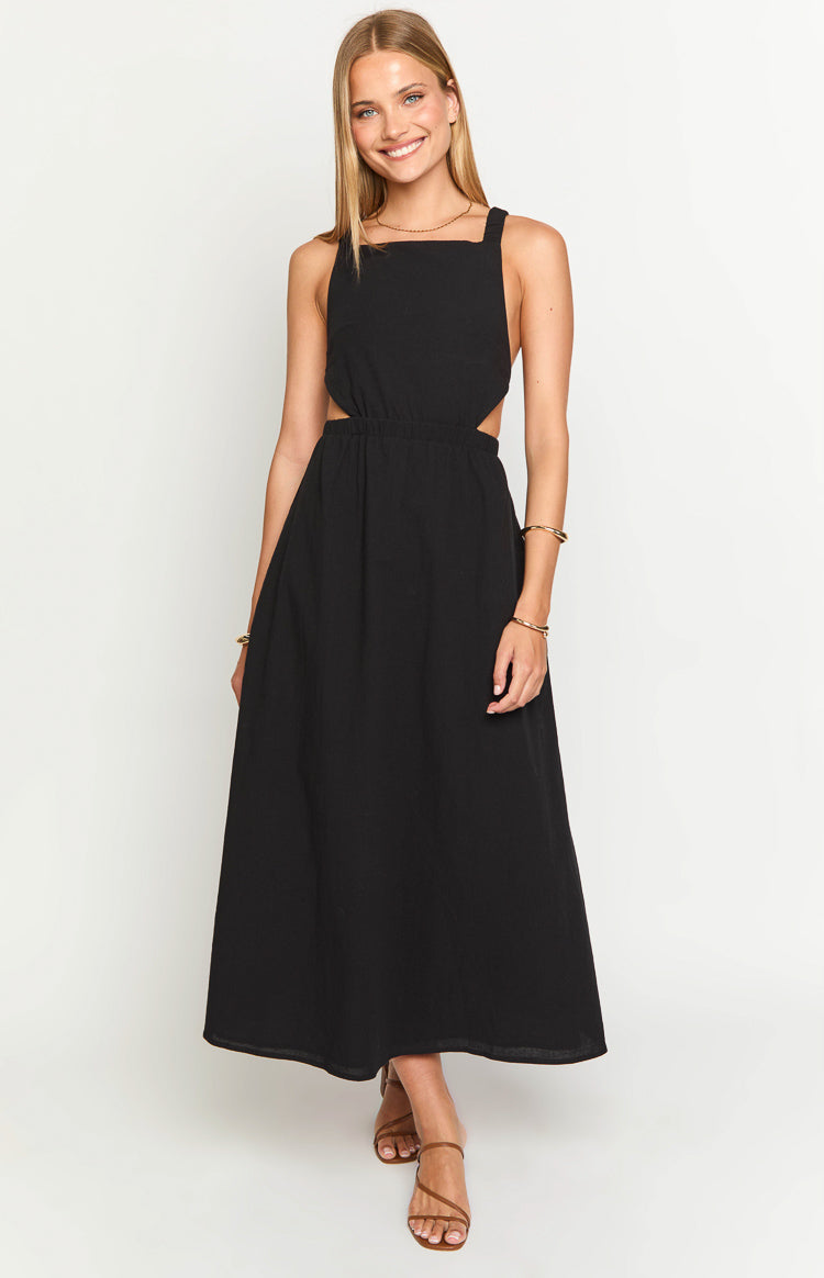 Black midi dress with a square neckline, wide straps, side cutouts, and an elasticated waist