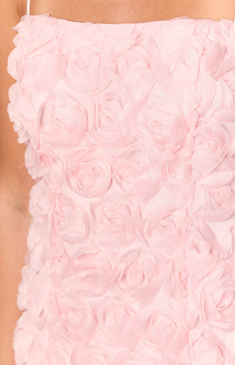 Close-up of the light pink sheer layered floral rosettes on the mini dress