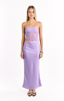 A long- lavender strapless dress with a sheer- ruched midriff cutout and a flowing satin skirt. This dress is perfect for a special vacation dinner or a semi-formal event.
