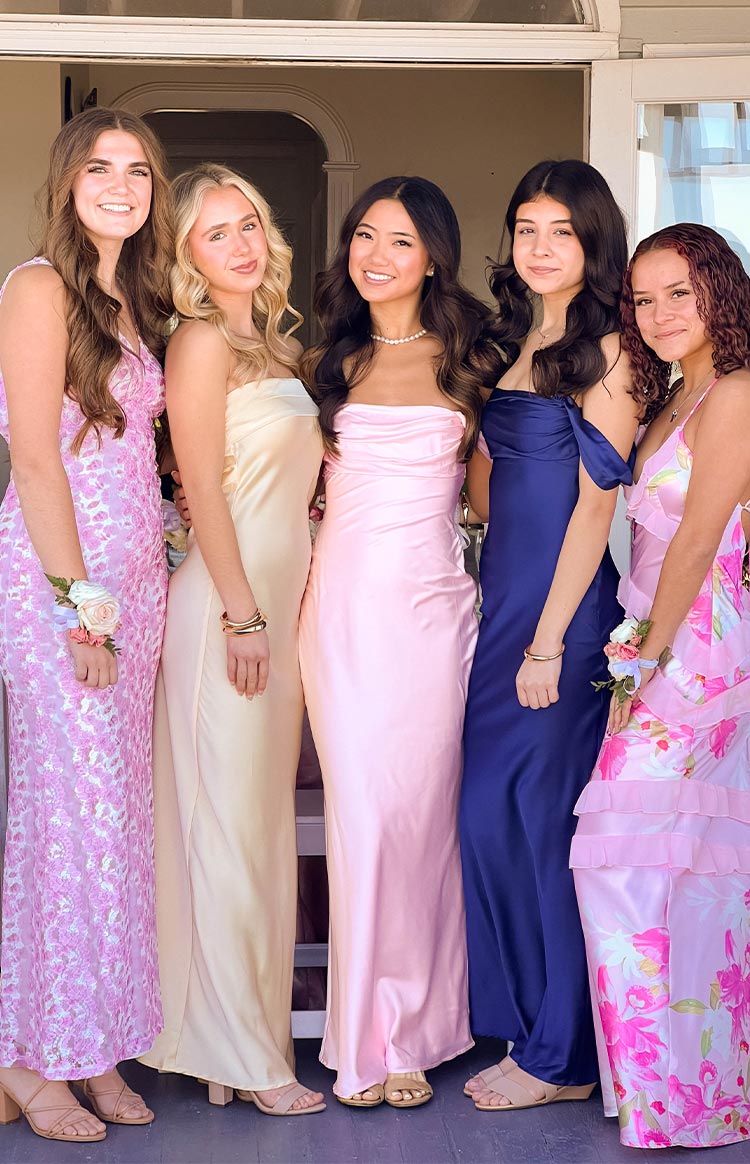 Light pink satin off-shoulder maxi dress with a ruched bodice and fitted silhouette