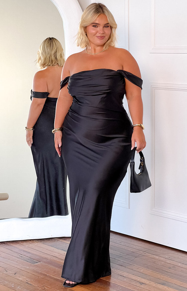 Front view of a black satin off-shoulder maxi dress with a draped neckline and fitted silhouette