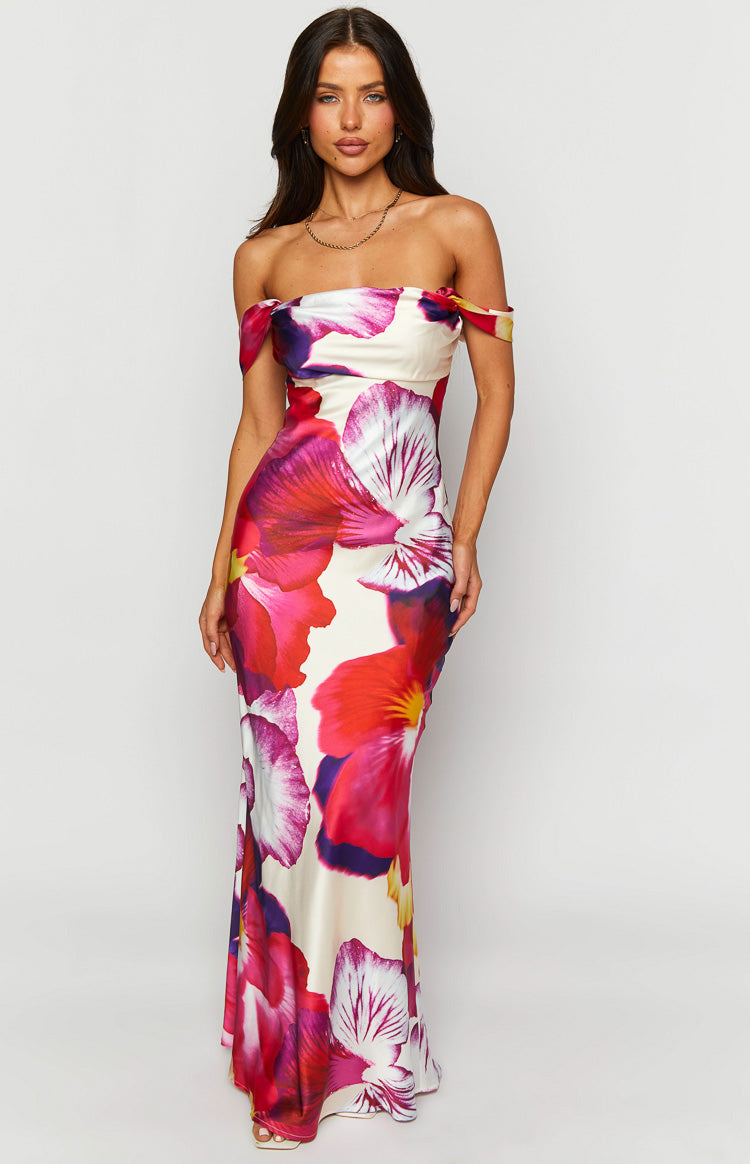 Front view of a cream off-shoulder bodycon maxi dress with large pink and red floral print and a slight flare