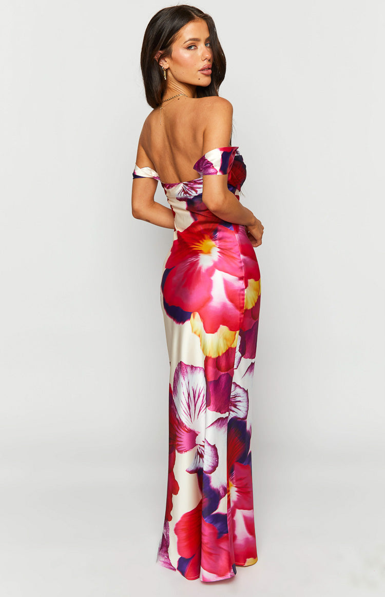 Rear side view of the satin off-shoulder formal dress with a pink and purple floral print and a fitted maxi skirt