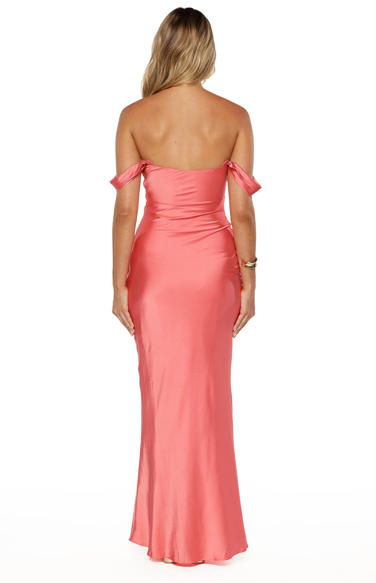 Rear view of a pink off-shoulder maxi dress with draped sleeves and a fitted silhouette