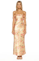 Model in a long yellow satin dress with pink floral print and a cowl neck ideal for a Formal occasion