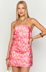 Front view of an orange strapless mini dress with a vibrant pink floral print