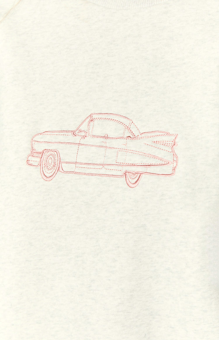 Close-up of the pink embroidered vintage car design on the grey crew neck sweater