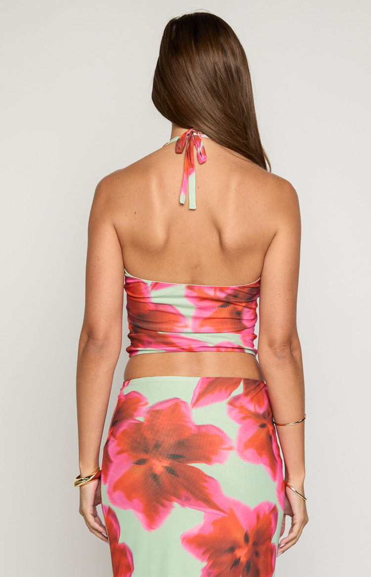 Back view of the green floral halter top with a tie closure at the neck